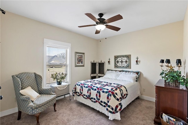 bedroom featuring carpet floors, a ceiling fan, and baseboards