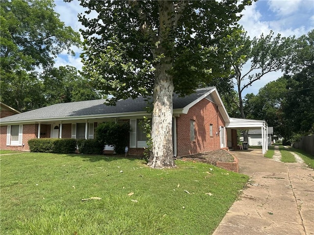 604 W Buck St, Caldwell, TX 77836 - view of front facade featuring brick siding, driveway, and a carport