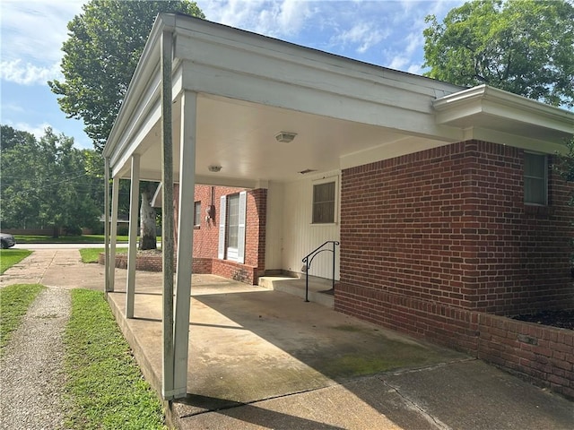 604 W Buck St, Caldwell, TX 77836 - view of side of property featuring brick siding and an attached carport