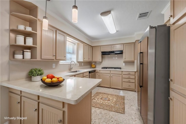 kitchen with kitchen peninsula, stainless steel appliances, light brown cabinetry, hanging light fixtures, and sink