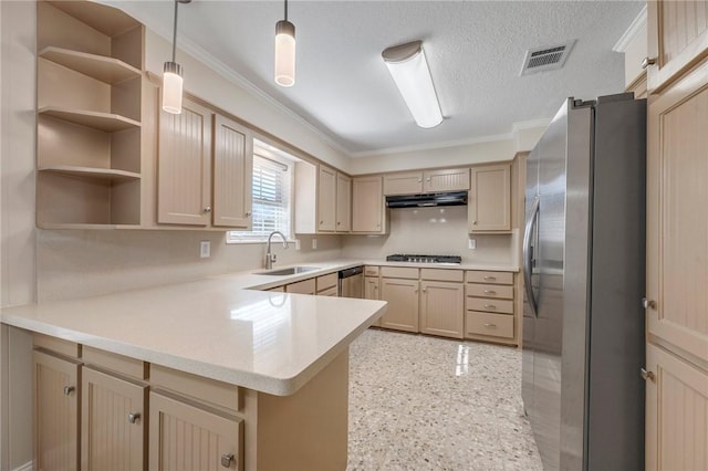 kitchen featuring appliances with stainless steel finishes, decorative light fixtures, light brown cabinetry, sink, and kitchen peninsula