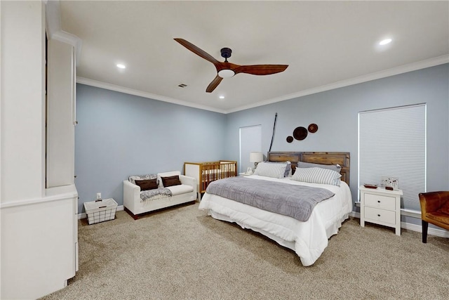 bedroom featuring carpet, ornamental molding, and ceiling fan