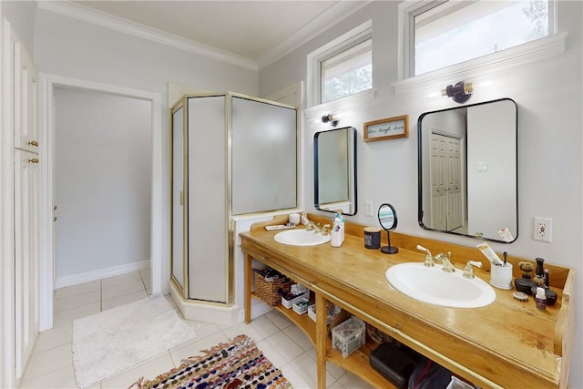 bathroom featuring vanity, crown molding, a shower with shower door, and tile patterned floors