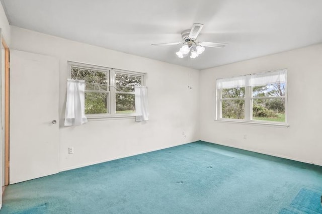 unfurnished room featuring carpet floors and a ceiling fan