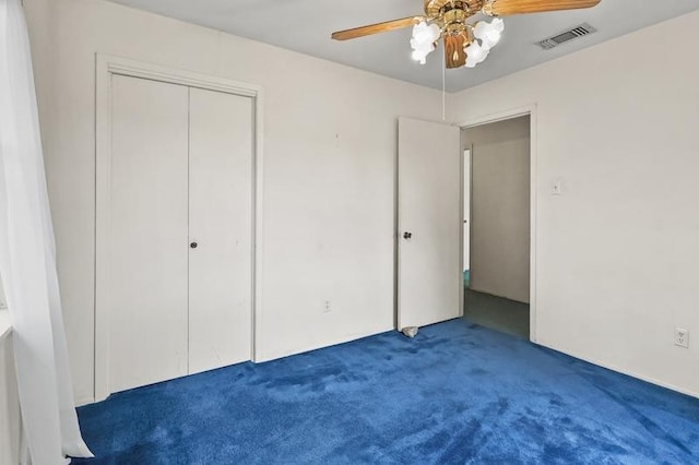unfurnished bedroom featuring ceiling fan, carpet, a closet, and visible vents
