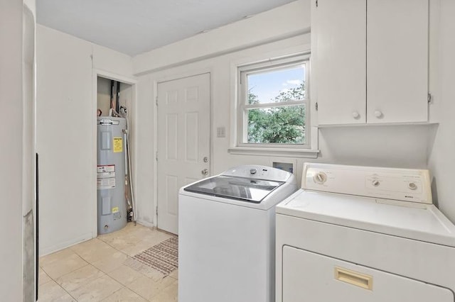 laundry room with cabinet space, water heater, and washing machine and clothes dryer