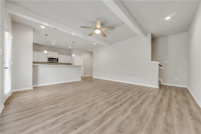 515 Hayes Ln, College Station, TX 77845 - unfurnished living room with ceiling fan, light wood-style flooring, recessed lighting, stairs, and beamed ceiling