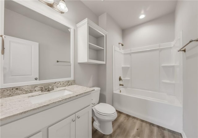 515 Hayes Ln, College Station, TX 77845 - bathroom featuring vanity, wood finished floors, and bathing tub / shower combination