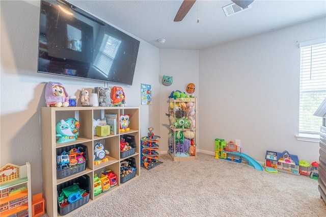 975 Harper Ln, Bryan, TX 77803 - recreation room featuring carpet, visible vents, and a ceiling fan