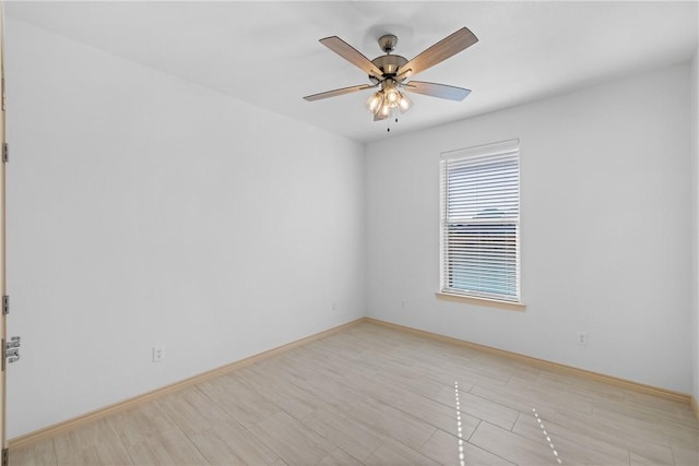 spare room featuring ceiling fan and light hardwood / wood-style flooring