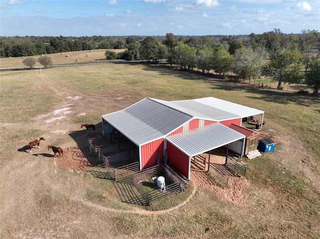 birds eye view of property with a rural view