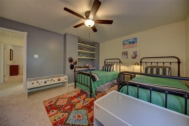 bedroom featuring ceiling fan and a textured ceiling