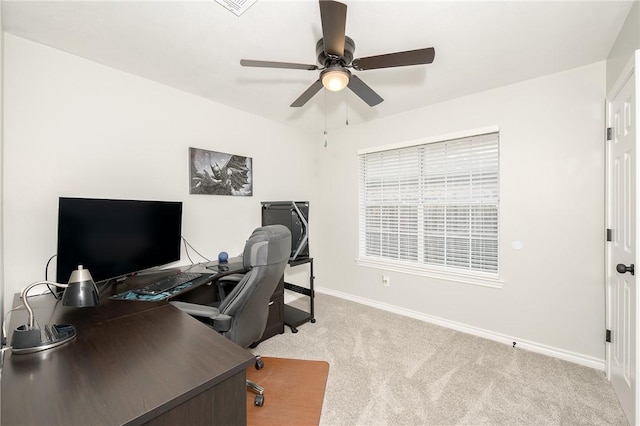 carpeted office featuring ceiling fan