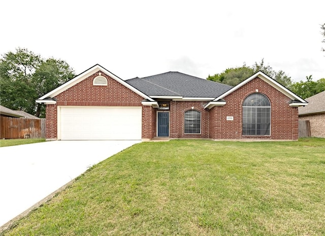 ranch-style house with a garage and a front lawn