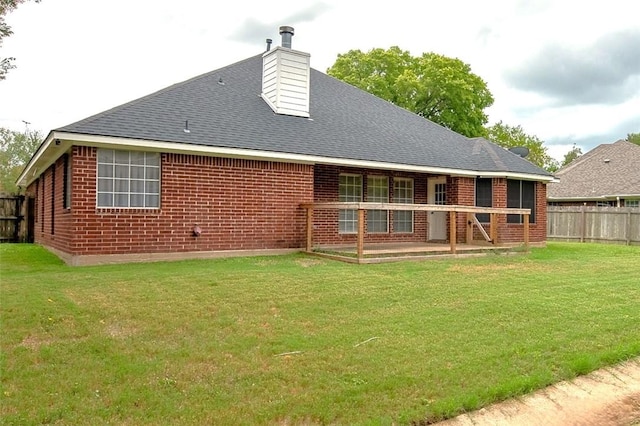 back of house featuring a yard and a patio