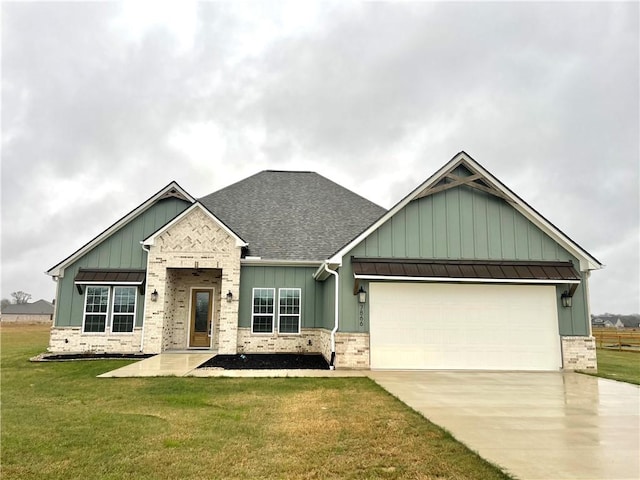 craftsman-style home with a garage and a front lawn