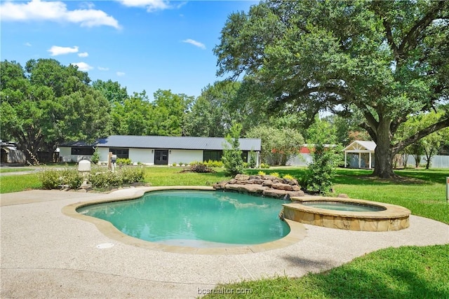 view of swimming pool with an in ground hot tub and a lawn