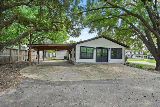 exterior space featuring french doors and a carport