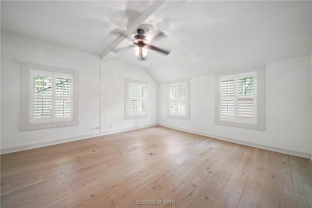 unfurnished room featuring ceiling fan, light hardwood / wood-style flooring, a wealth of natural light, and vaulted ceiling