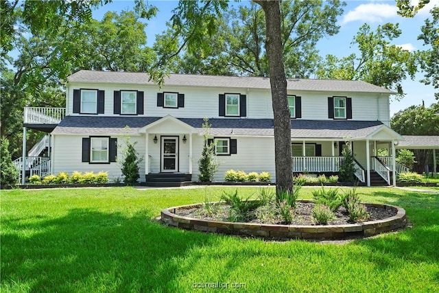 view of front of house featuring a porch and a front lawn