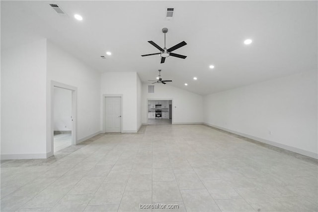 unfurnished living room with ceiling fan, high vaulted ceiling, and light tile patterned floors