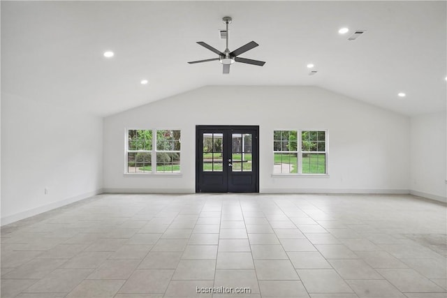 empty room featuring french doors, light tile patterned floors, vaulted ceiling, and ceiling fan