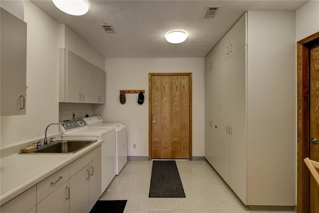 16414 Calumet Trl, College Station, TX 77845 - laundry room featuring cabinet space, washer and dryer, light floors, and baseboards