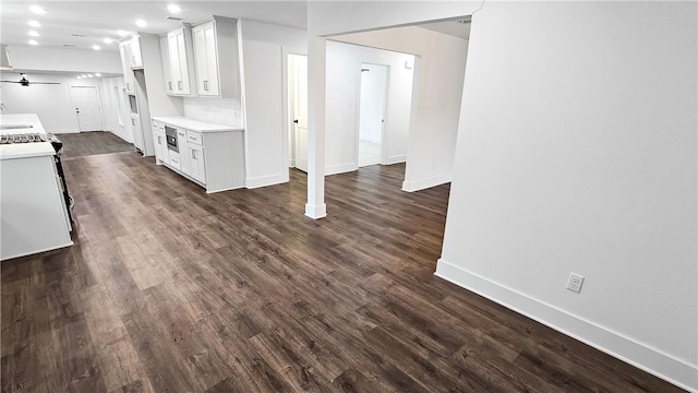 kitchen featuring dark wood finished floors, white cabinetry, light countertops, and ceiling fan