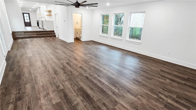 unfurnished living room featuring dark wood finished floors, recessed lighting, baseboards, and a ceiling fan