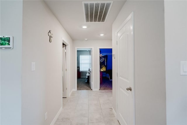 2140 Chief St, Bryan, TX 77807 - hall with light tile patterned floors and recessed lighting