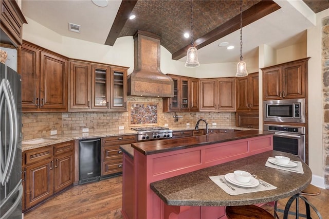 kitchen featuring stainless steel appliances, premium range hood, visible vents, brick ceiling, and dark wood-style floors