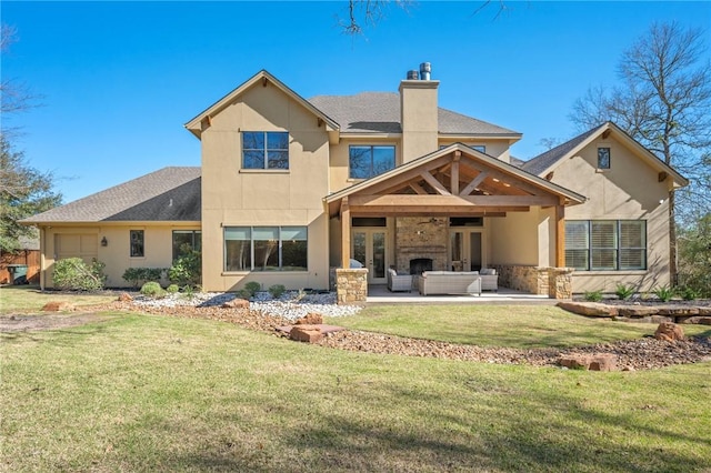 back of property featuring ceiling fan, a chimney, a yard, a patio area, and outdoor lounge area