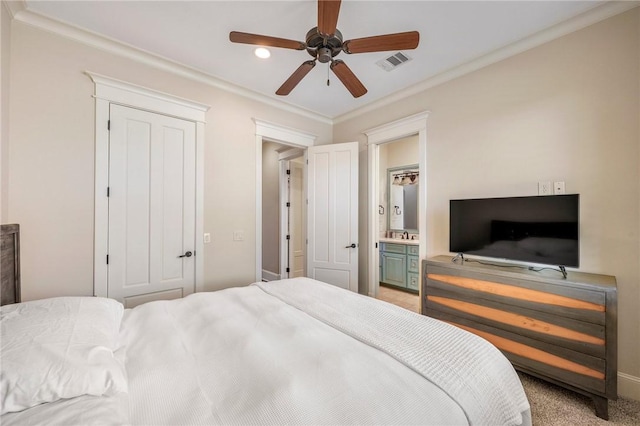 carpeted bedroom with visible vents, connected bathroom, ceiling fan, ornamental molding, and a closet