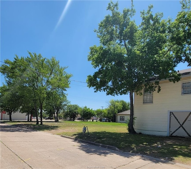 view of yard featuring a garage