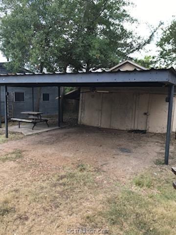 view of outbuilding with a carport