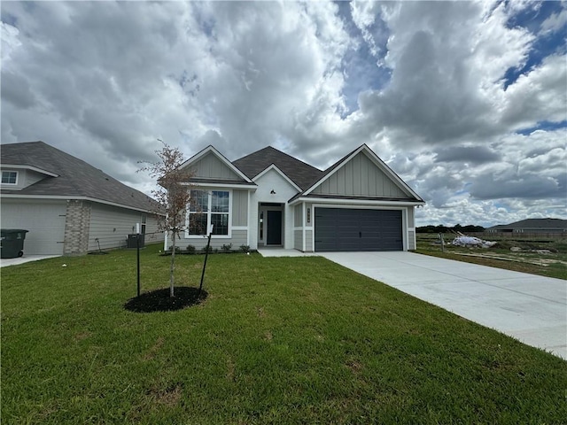 view of front of house with a garage and a front lawn