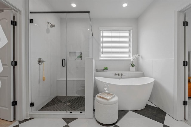 bathroom featuring plus walk in shower