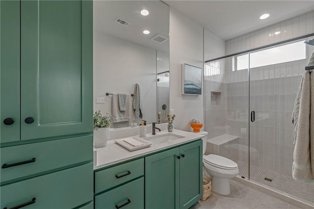 bathroom with tile patterned floors, vanity, toilet, and walk in shower