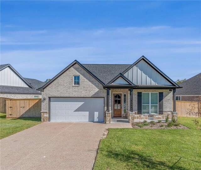 view of front of home with concrete driveway, brick siding, a garage, and board and batten siding