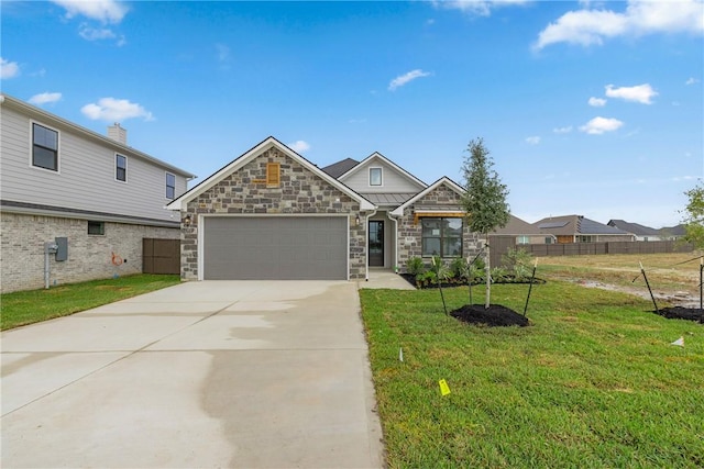 5020 Toscana Loop, Bryan, TX 77802 - craftsman house featuring a front yard, fence, concrete driveway, an attached garage, and stone siding