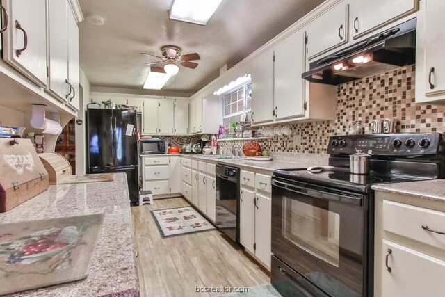 kitchen with backsplash, white cabinets, and black appliances