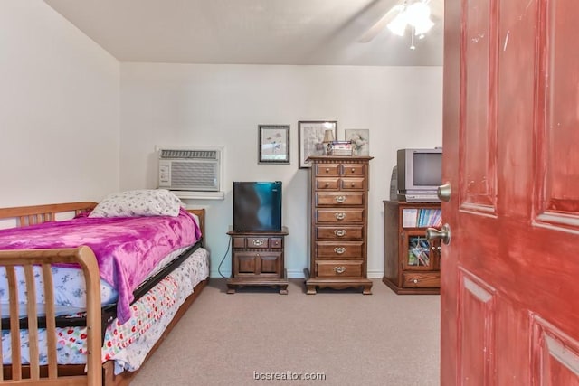 bedroom featuring ceiling fan, carpet floors, and a wall mounted AC