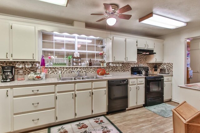 kitchen with light wood-type flooring, backsplash, ceiling fan, sink, and black appliances