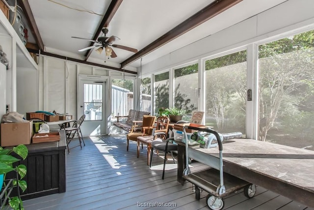 sunroom / solarium featuring ceiling fan, lofted ceiling, and a wealth of natural light