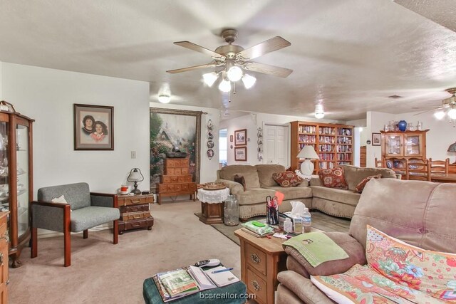 living room featuring ceiling fan and light carpet