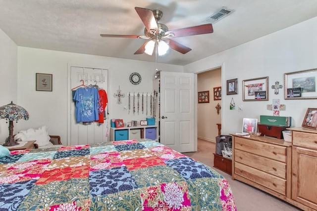 bedroom with ceiling fan and light colored carpet