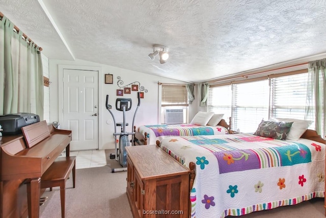 bedroom with vaulted ceiling, light carpet, and a textured ceiling