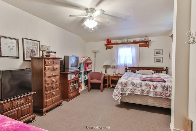 bedroom with light colored carpet, ceiling fan, and lofted ceiling