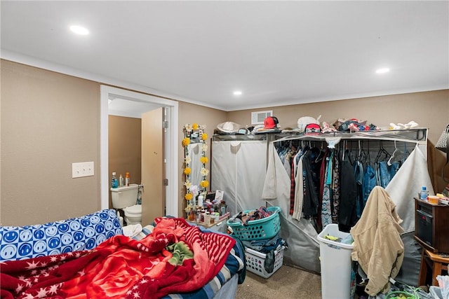 carpeted bedroom with connected bathroom