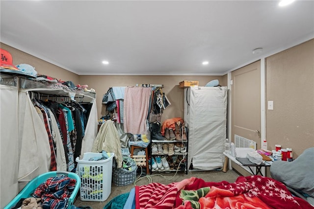 spacious closet with dark colored carpet